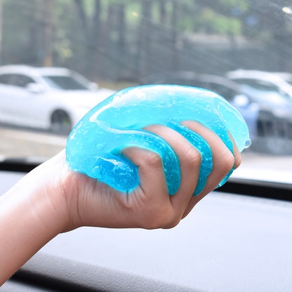 Magic Car Cleaning Gel for Interior Detailing - Cleaning gel in hand reaching into the car vent