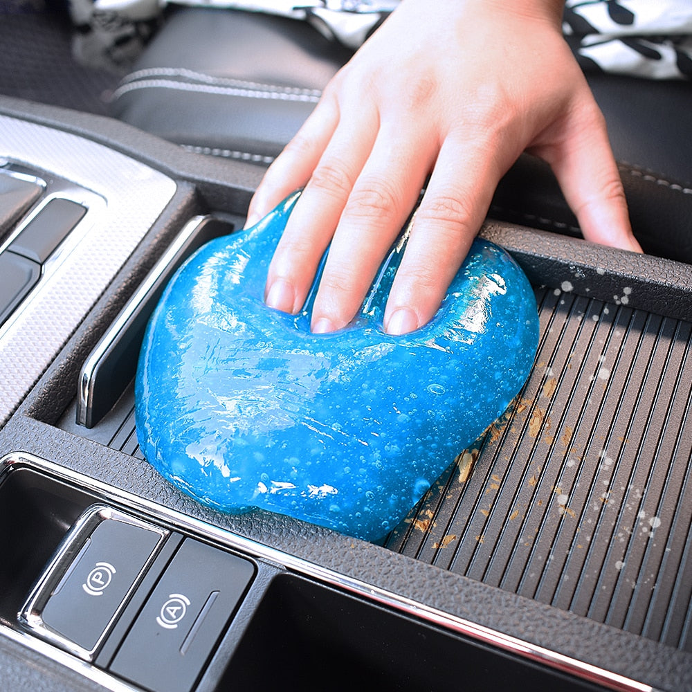 Magic Car Cleaning Gel for Interior Detailing - Cleaning gel in hand reaching into the car vent
